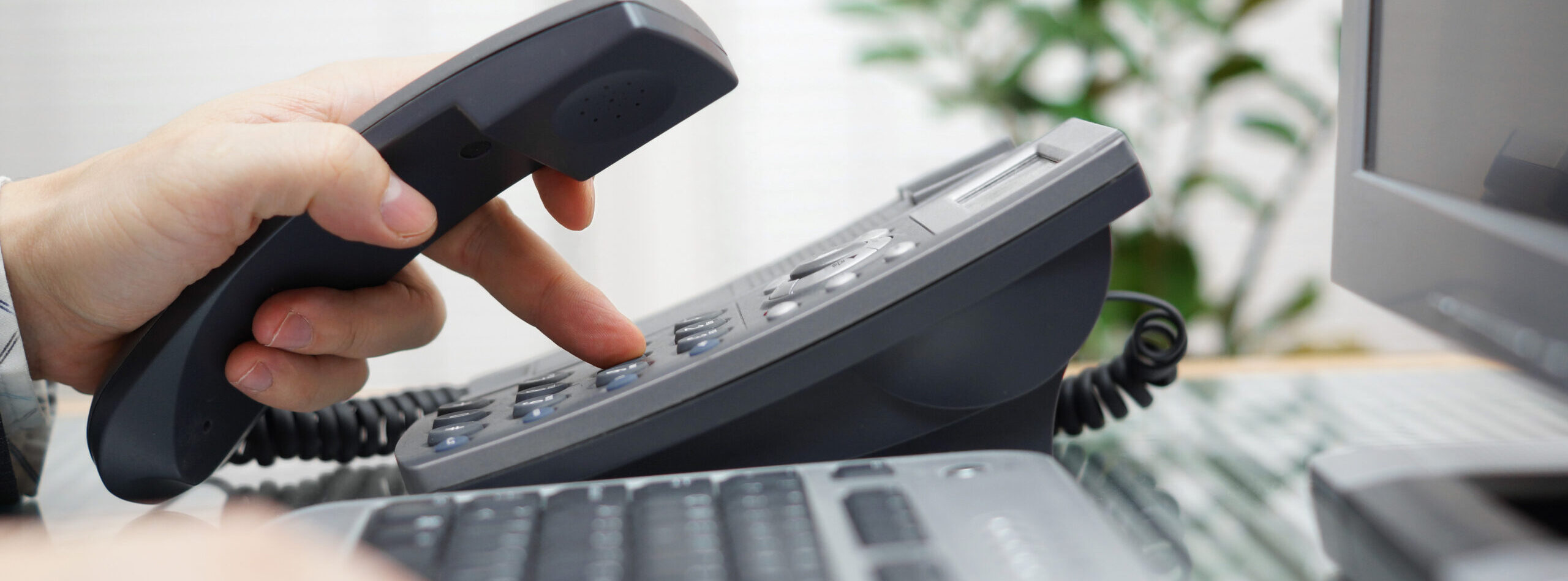 businessman is dialing a phone number in office